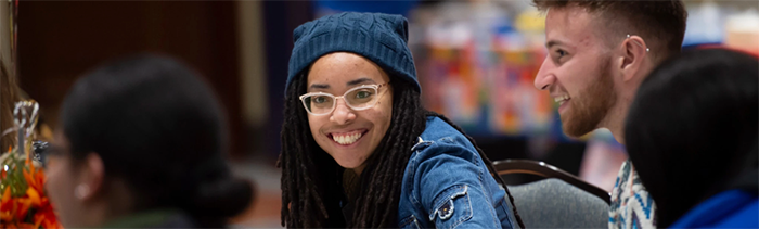 smiling student in group event