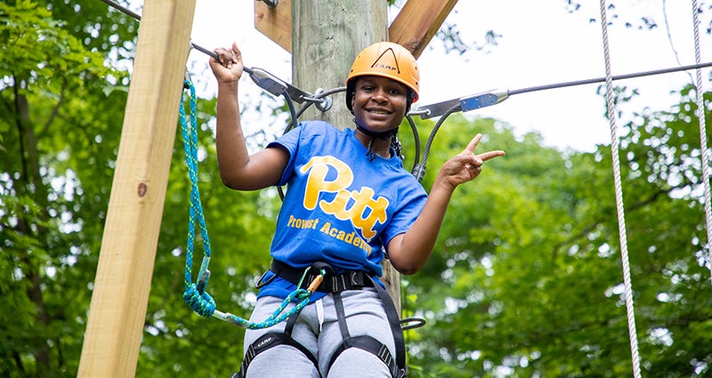 Provost Academy student participating in outdoor climbing activity.