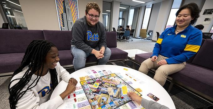students playing Pittsburgh edition of Monopoly