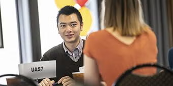 Student meets with a company representative during a Pitti-hosted job fair. 
