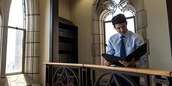 student reading in Honors College floor