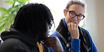 Faculty tutor meets with student at the Writing center.