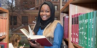 student in library