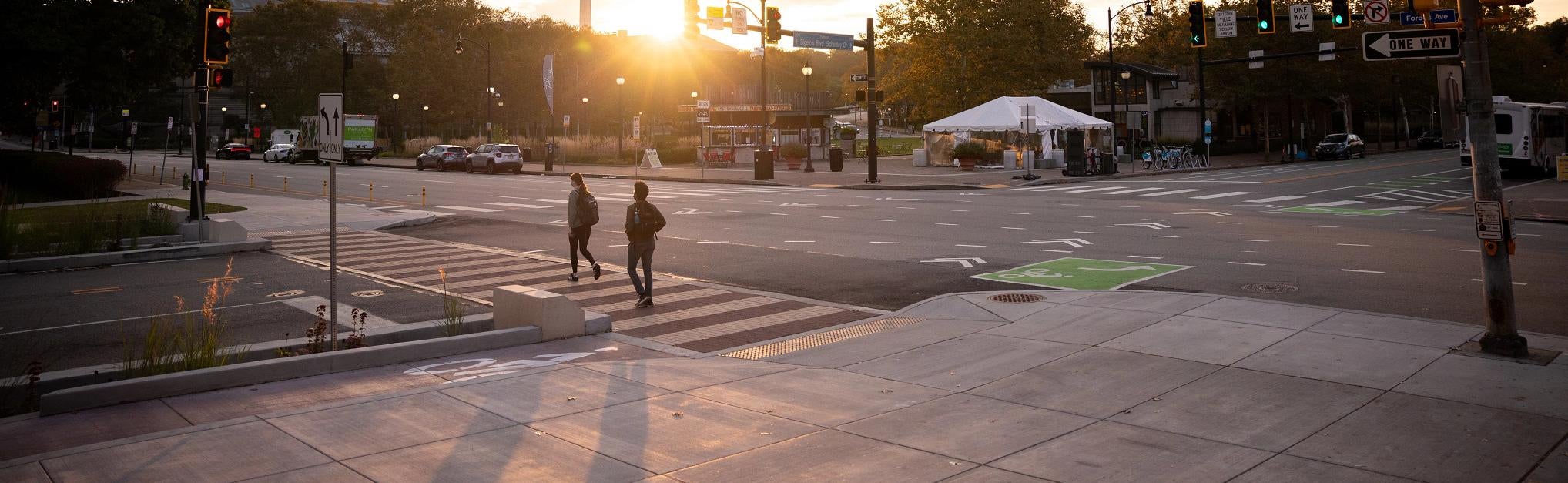 campus crossroads with students walking to class